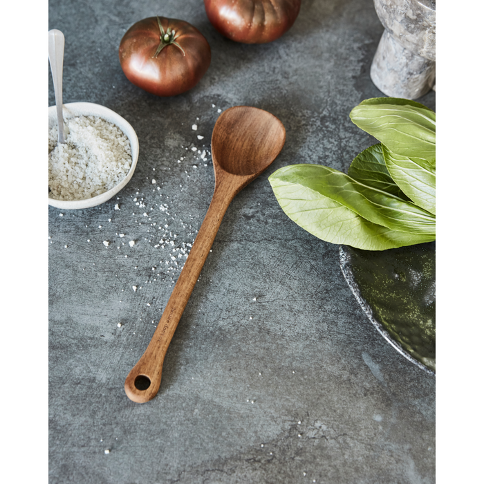 Wooden spoon styled on a kitchen counter with salt and vegetables – North Home lifestyle photo
