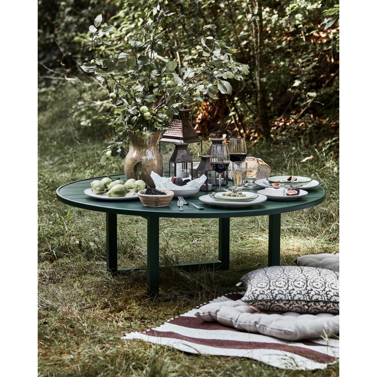 Modern green metal coffee table for patio lounging or garden gatherings