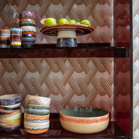 burgendy perspex shelves hold coourful items from HKlivings 70s ceramics collction