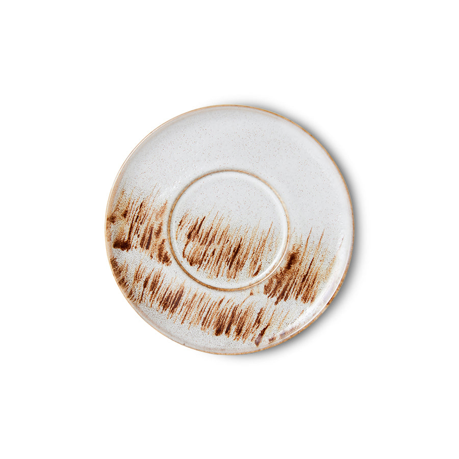 brown and beige plate that looks like grass swaying in a field