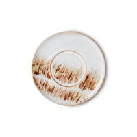brown and beige plate that looks like grass swaying in a field