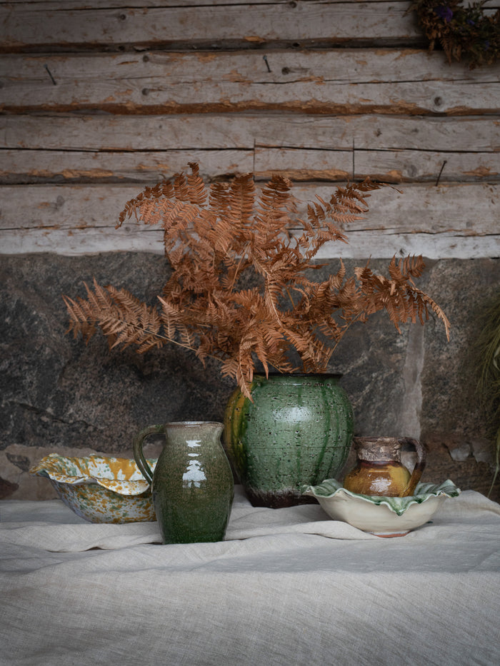 Rustic styling with painterly ceramic bowl and natural textures