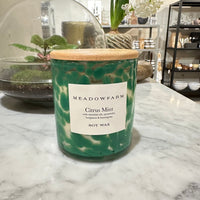 Clean and natural scented candle with green details in clear glass