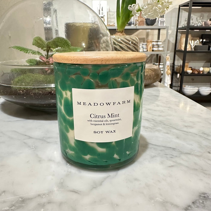 Clean and natural scented candle with green details in clear glass