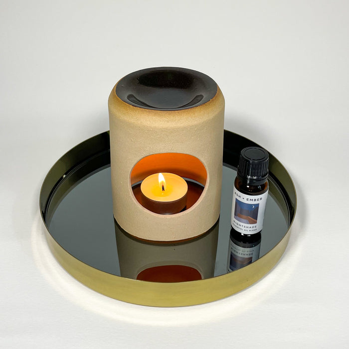 nightshade essential oil by ash and ember in an oil burner