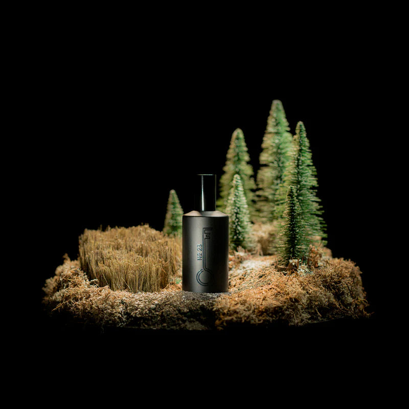a bottle of the hand filled, handmade fishersund no. 23 spray fragrance set in a model of a patch of Iceland in the early autumn