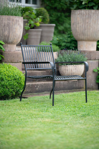 Antique terracotta outdoor pots by Wikholmform styled in garden setting