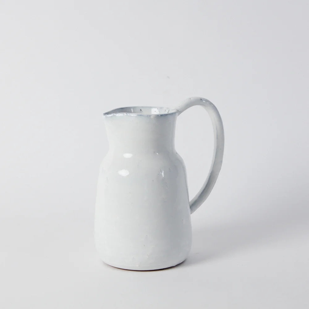 a stright sided jug with a long slender handle in white glaze handmade for style and difference