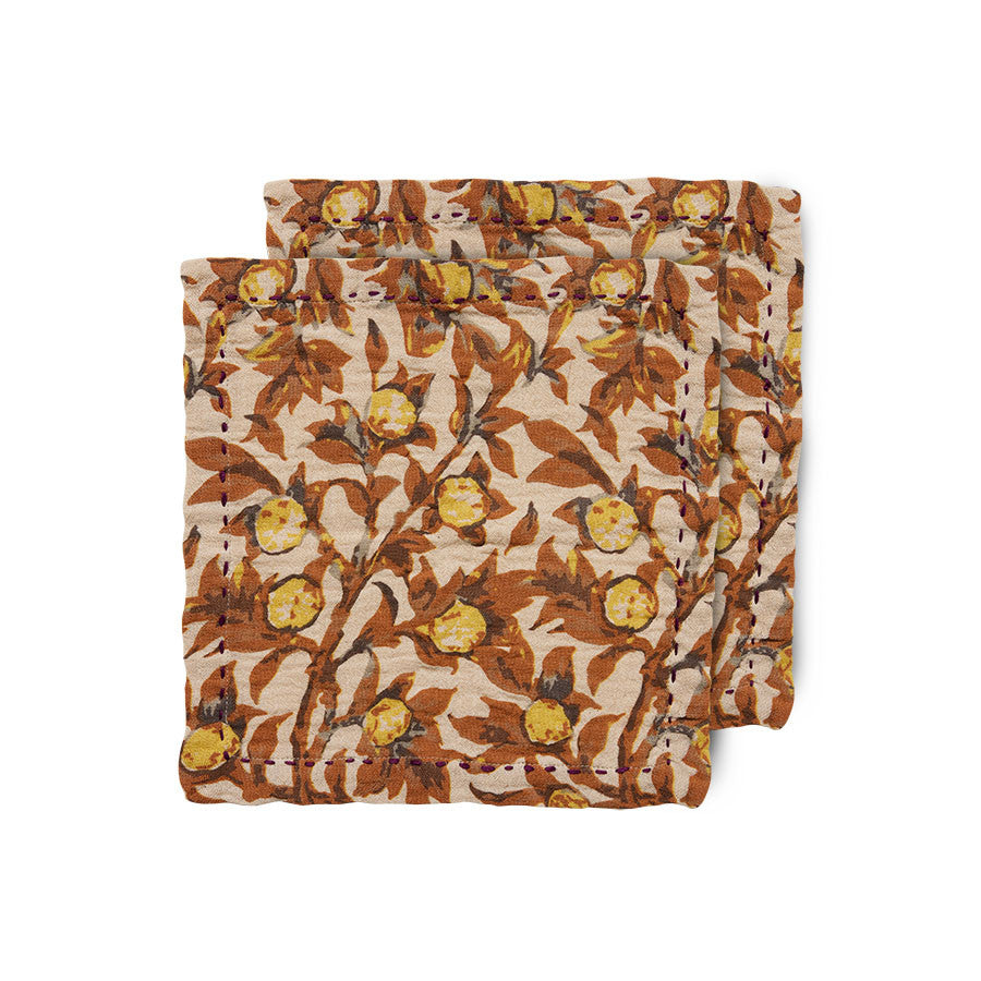 2 cloth napkins with image of tangerines on the branch with the brnaches in brown and yellow instead of green leaves creating an autumnal warmth from the hk living dutch design house