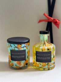 Triple wick sustainable candle in colourful glass jar