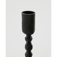 detail of ethnic-style handmade iron candlestick by house doctor