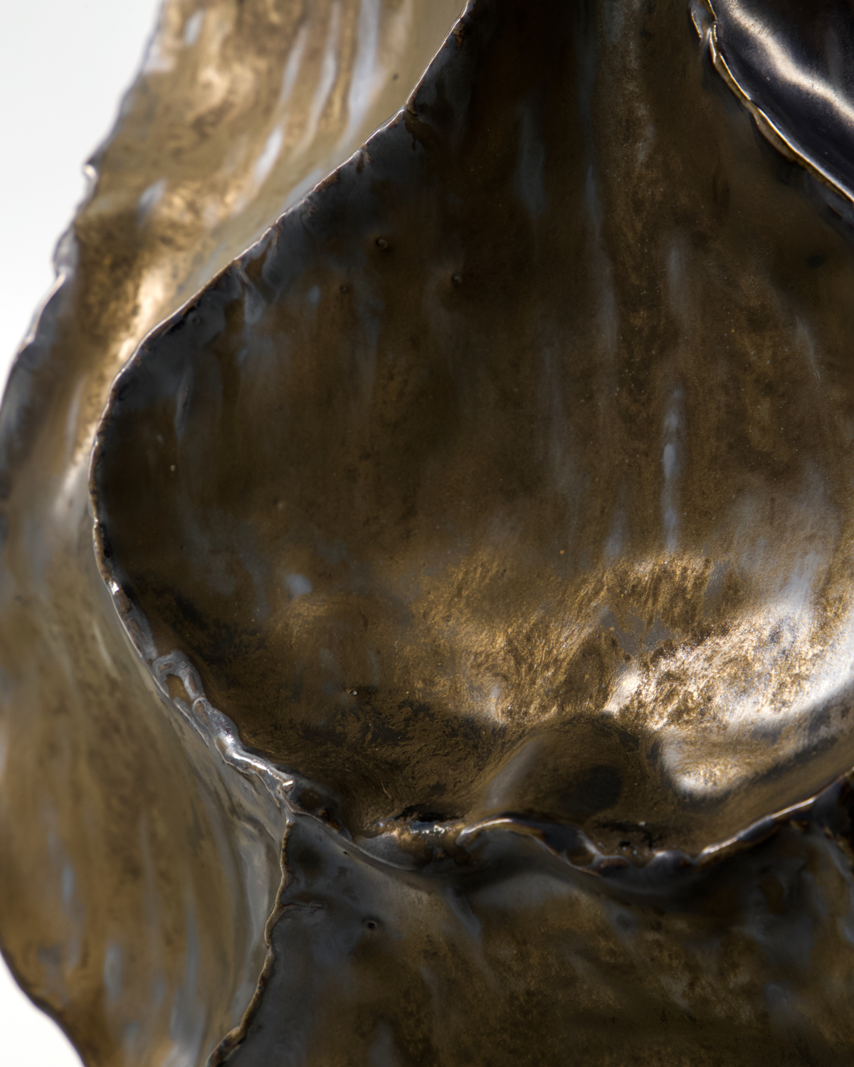 Handcrafted edges and bronze tones of the House Doctor HDWaves sculptural vase.