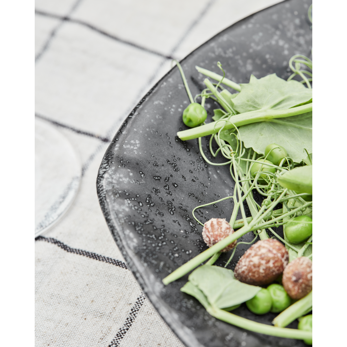 Elegant Nordic-inspired table setting with black ceramic fish platter