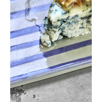 Close-up of glossy blue stripe detail on ceramic board