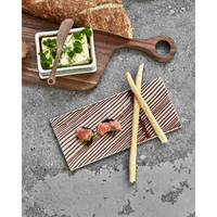 Brown ceramic board styled with salmon and breadsticks for entertaining