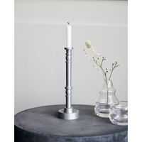 jersey candle holder by house doctor styled with glass vases on neutral background