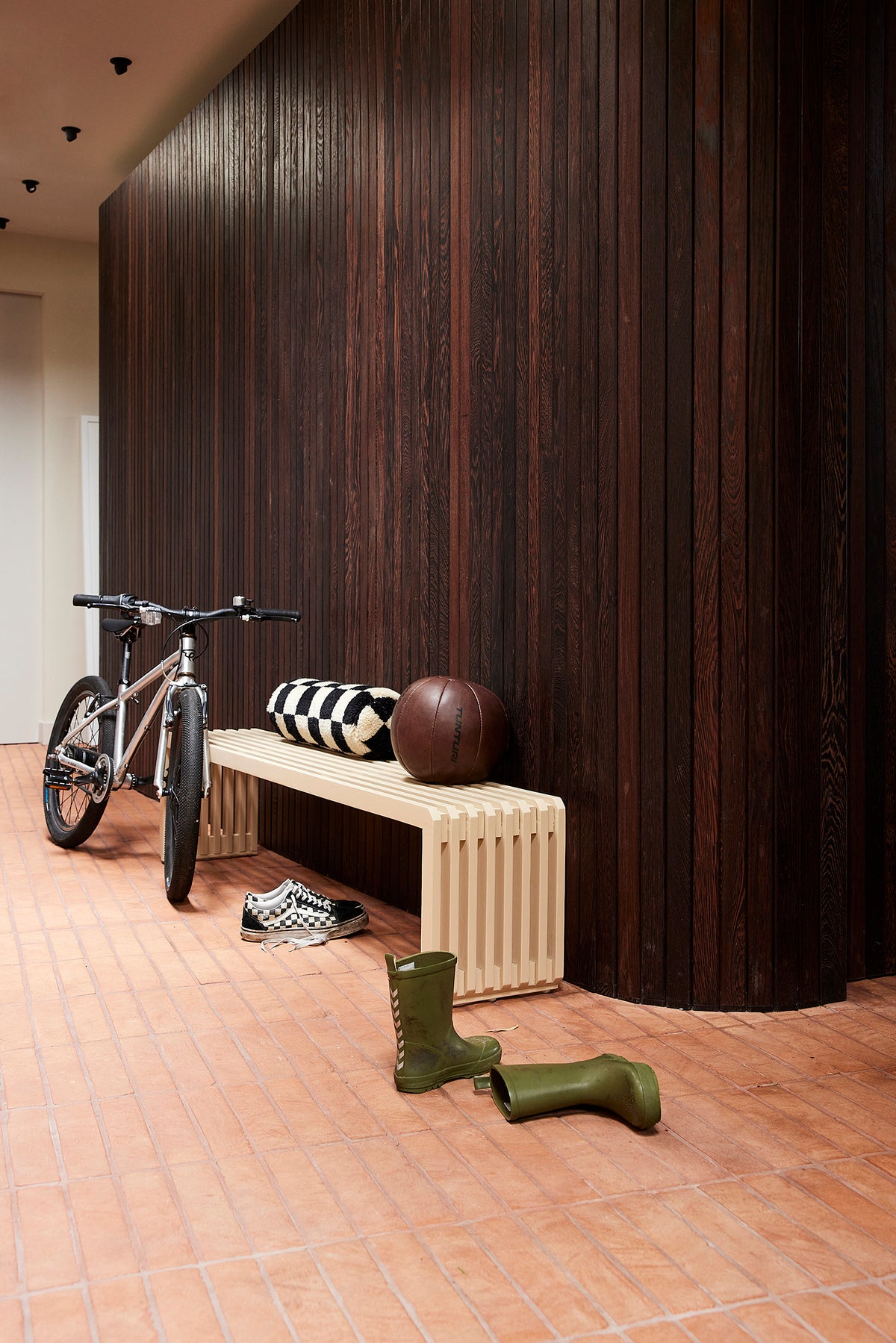 Long sand slatted sungkai wood bench by hkliving styled in a modern hallway