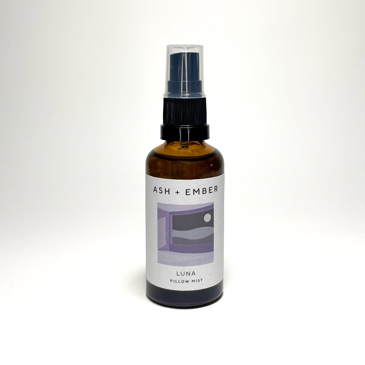 Luna Pillow Mist by Ash + Ember in amber glass bottle with lavender and clary sage scent