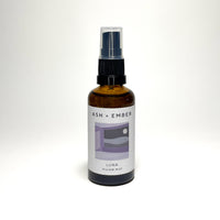 Luna Pillow Mist by Ash + Ember in amber glass bottle with lavender and clary sage scent