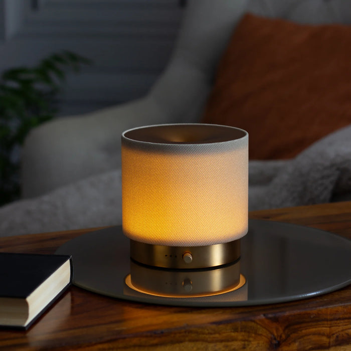 Mira diffuser illuminated with ambient glow in a relaxed evening setting
