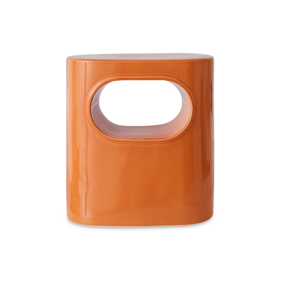 glossy orange end table from hkliving with a hole thorugh the middle creating an almost shelf within the table itself