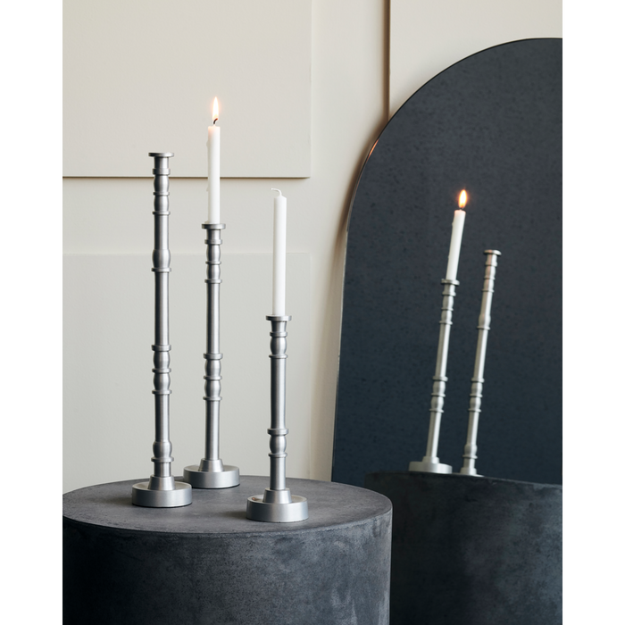 silver oxidized candlesticks in three sizes with white taper candles