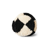 view of the end of the fluffy black and white cushion