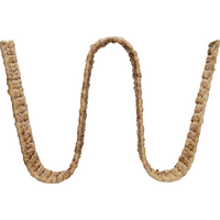 front view of wave-shaped magazine holder by house doctor in natural wicker