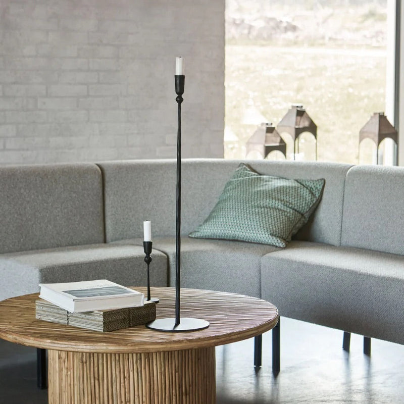 Candle Stand Trivo Black Tall styled in a modern living room on a wooden coffee table, featured as the main image for North Home’s candle holder guide.