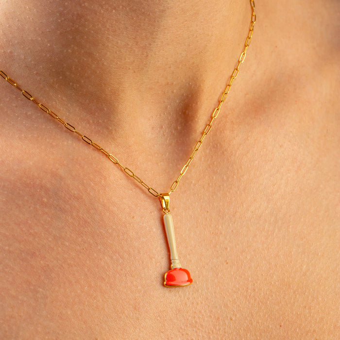 Seletti Toiletpaper sink plunger necklace with gold chain and red plunger pendant, worn on neck, 28mm
