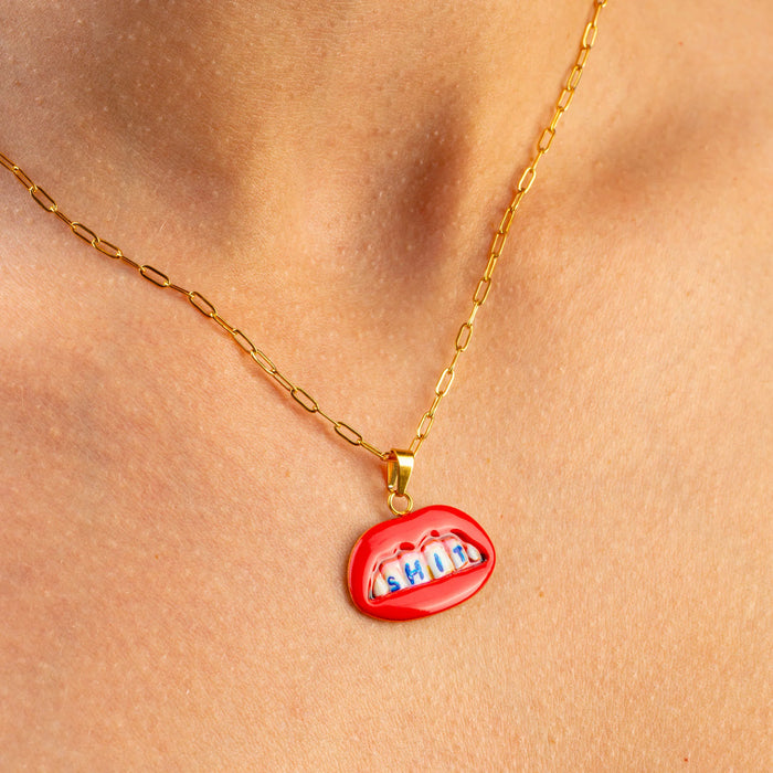 Seletti Toiletpaper SHIT necklace with gold chain and red lips pendant, worn on neck, 25mm
