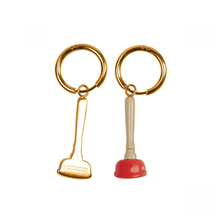 gold hoop earrings with plunger charms, one solid and one showing the reverse side witht the Seletti Toiletpaper branding
