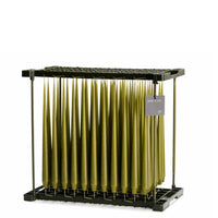 olive flow coloured taper candles in dipping rack