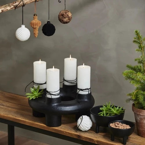 pillar candles in a round candle holder