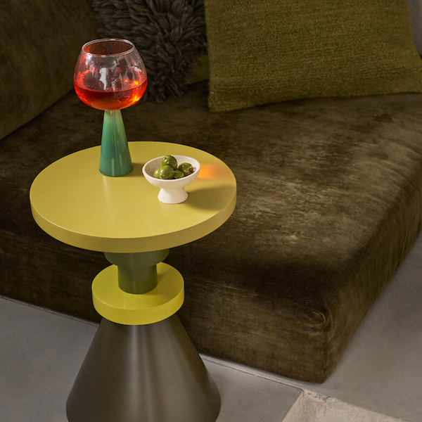 small lav bowl with olives styled on a colourful side table
