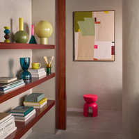 colourful mango wood Leken candle holder by Urban Nature Culture styled on warm wooden shelves