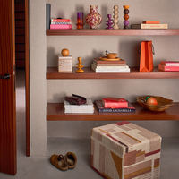 additional lifestyle styling of Leken candle holder with books and ceramics
