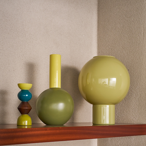close-up of totem-inspired Signe candle holder in mango wood with vibrant earthy colours