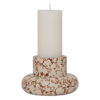 Mukava candle holder by Urban Nature Culture holding a pillar candle, showing marbled print
