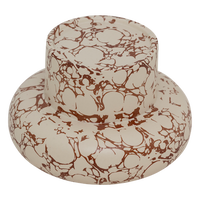 angled view of organic-shaped Mukava ceramic candle holder with decorative marbling