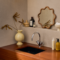 neutral speckled ceramic zody candle holder styled in bathroom shelf decor