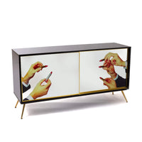 Surreal sliding door cabinet in black and gold with lipstick imagery
