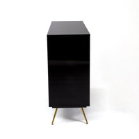 side view of toiletpaper and seletti chest of drawers showing the mirror black finish and gold legs