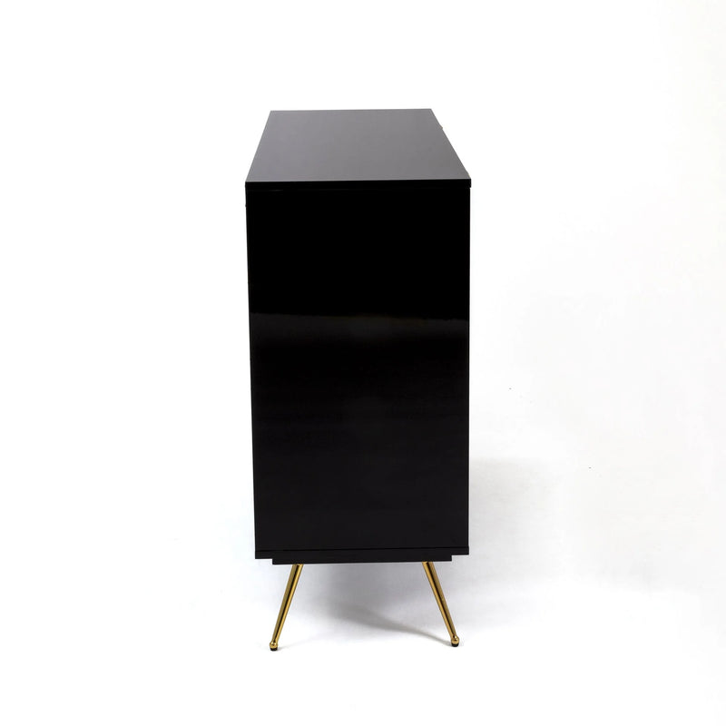 side view of toiletpaper and seletti chest of drawers showing the mirror black finish and gold legs