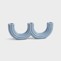 glossy light blue ceramic churros candle holder showing curved twin arches