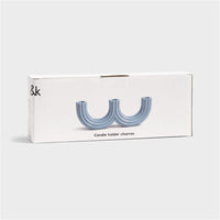 light blue churros candle holder by &k in packaging showing sculptural curved design