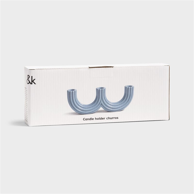 light blue churros candle holder by &k in packaging showing sculptural curved design