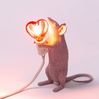 Seletti Pink Mouse Lamp with its red heart bulb glowing