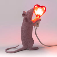 Seletti Pink Mouse Lamp with red heart bulb, styled shot