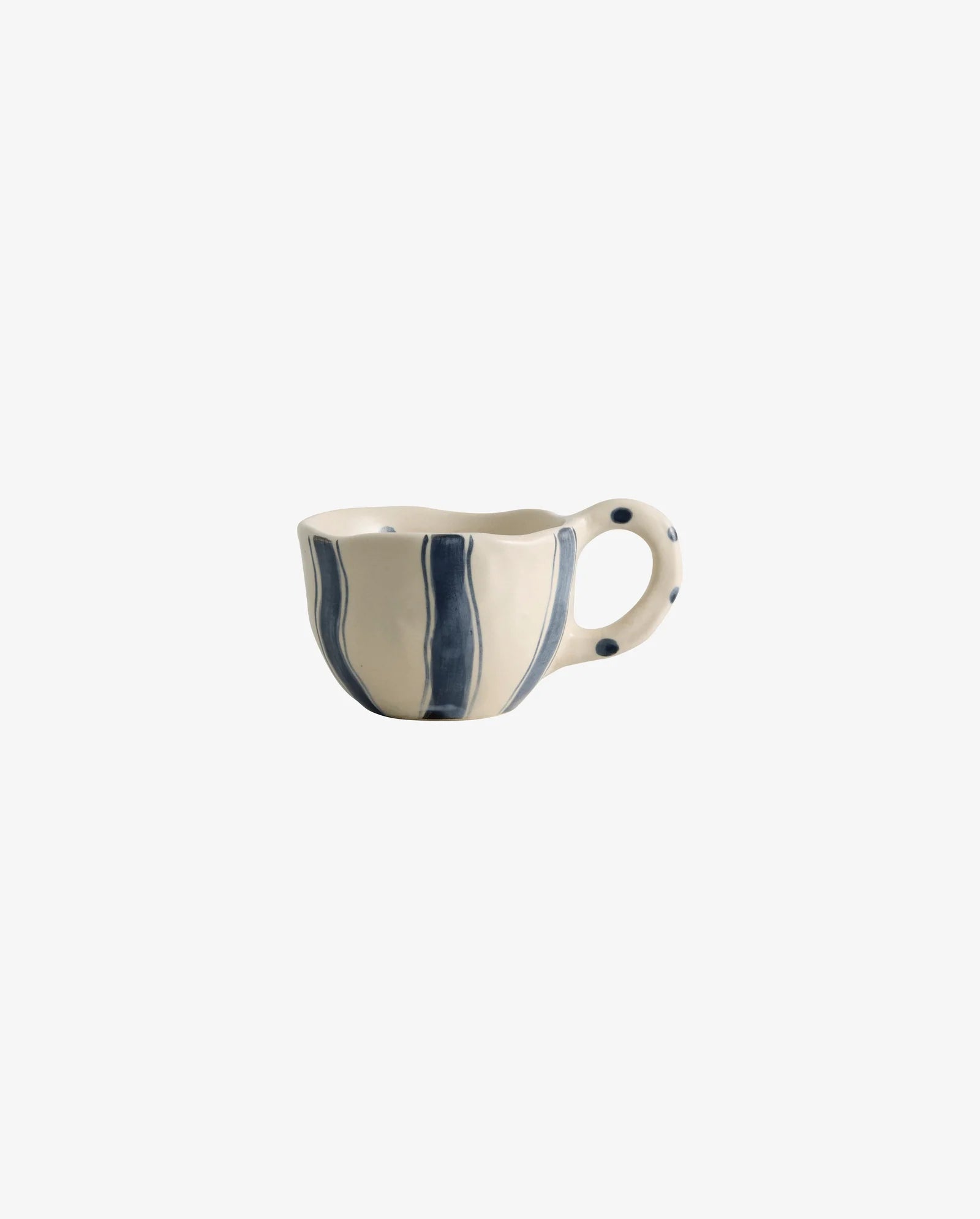 Assorted handpainted Atelier FORMA cups by Nordal displayed on a wooden shelf, including the striped GOGI cup